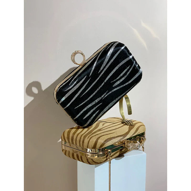 A premium handcrafted messenger bag made with luxurious horsehair and featuring a unique colourful brick ring buckle closure, showcasing the timeless charm of British craftsmanship.
