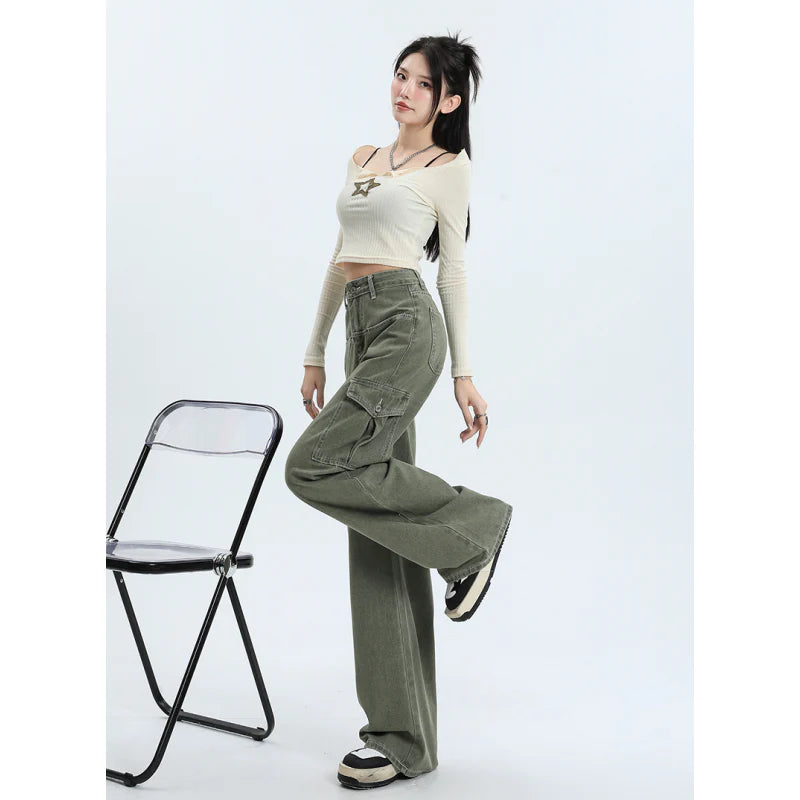 A pair of pink high-waist baggy jeans with a straight-leg design, featuring vintage-inspired details like buttons and faux zippers.