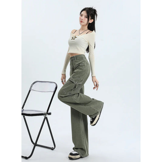 A pair of pink high-waist baggy jeans with a straight-leg design, featuring vintage-inspired details like buttons and faux zippers.