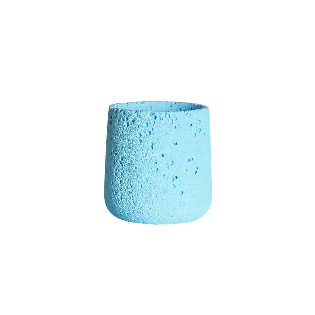 A modern, perforated cement bonsai planter in a Nordic-inspired design, available in various sizes and colours.