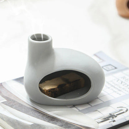 Elegant ceramic tabletop incense burner with Palo Santo wood aroma, available in light brown, white, and grey colours