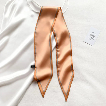 Luxury silk-feel narrow scarf in blue colour, a versatile fashion accessory for the modern British woman