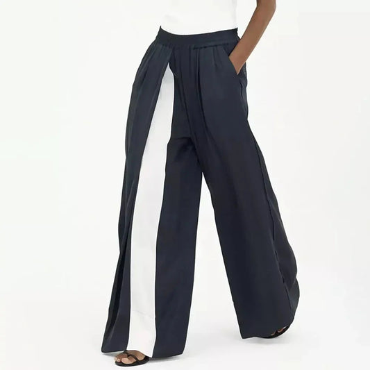 Chic navy high-waist wide-leg trousers with elegant patchwork design, offering timeless sophistication and modern style.
