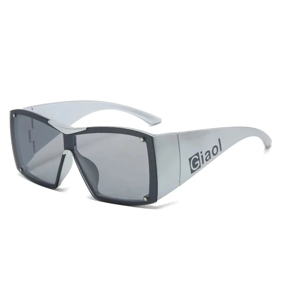Oversized square sunglasses with black lenses and a durable plastic frame, offering UV400 protection and adaptive photochromic technology.
