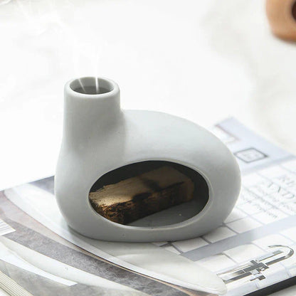 Elegant ceramic tabletop incense burner with Palo Santo wood aroma, available in light brown, white, and grey colours