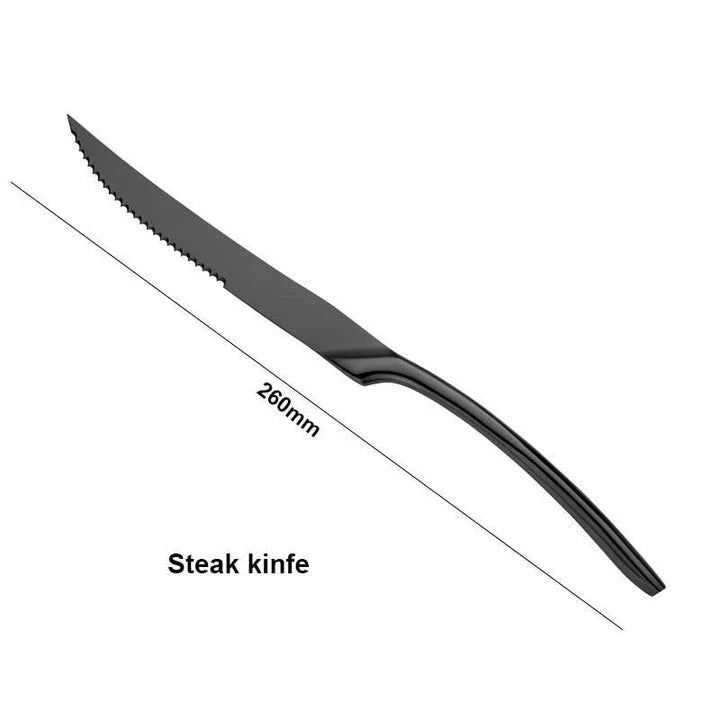 A stylish set of black stainless steel flatware, including a teaspoon, knife, and fork, on a white background.
