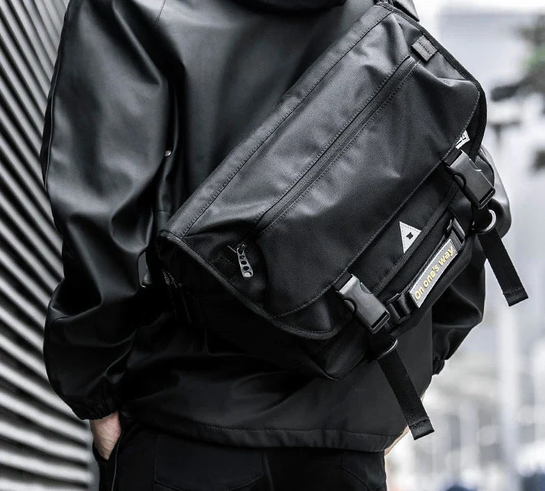 Premium casual messenger bag made with Oxford spinning material, featuring a structured yet soft exterior, ample storage space, and a water-resistant design for the modern British gentleman.
