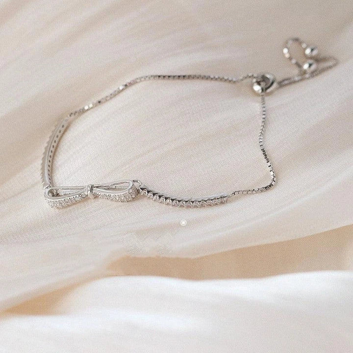 Elegant 925 sterling silver bow bracelet with minimalist design for stylish women