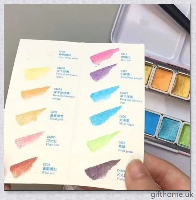 A set of vibrant watercolour paints with a glittering, iridescent effect, including brushes, a palette, and paper for a complete painting experience.