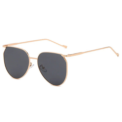 Elegant oval-shaped sunglasses with gradient lenses and alloy frames, offering timeless British style and UV protection.