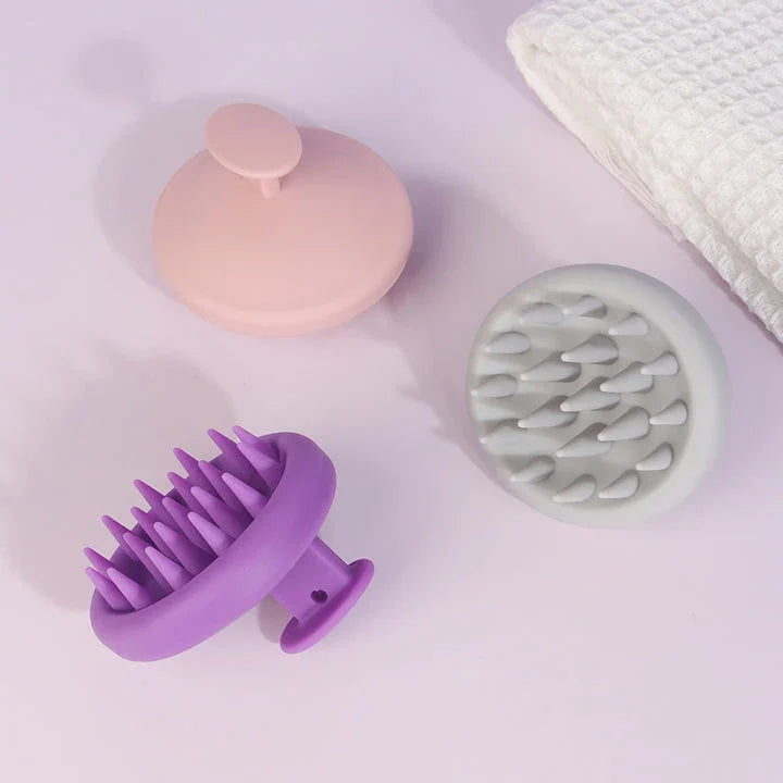 A green silicone scalp massager with soft bristles, designed to provide a soothing hair washing experience and promote healthy hair growth.