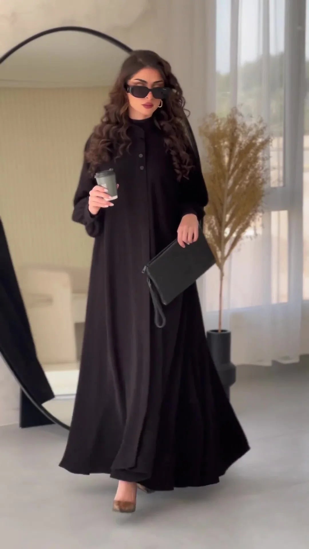 Premium black commuter swing skirt dress with long sleeves and an elegant A-line silhouette
