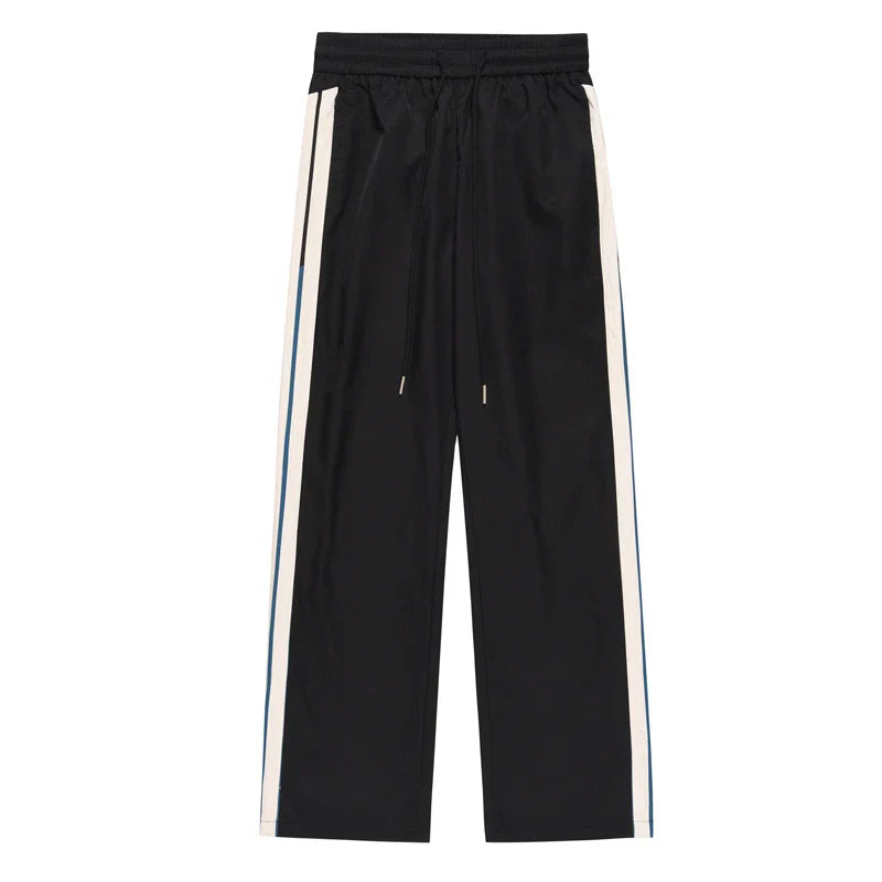Relaxed fit straight leg trousers in black and dark blue colours, perfect for the modern gentleman's casual wardrobe