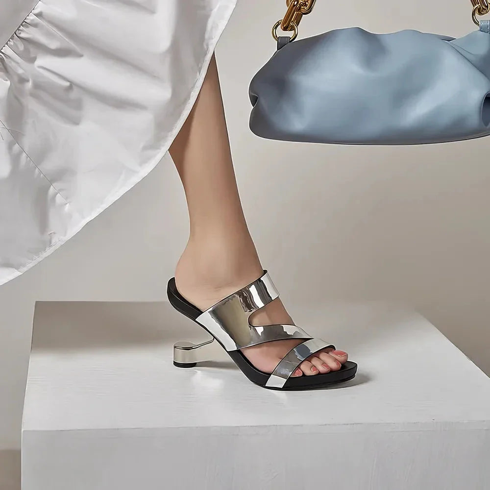 Genuine leather high heel slides with a unique and distinctive design, perfect for summer fashion and comfort.