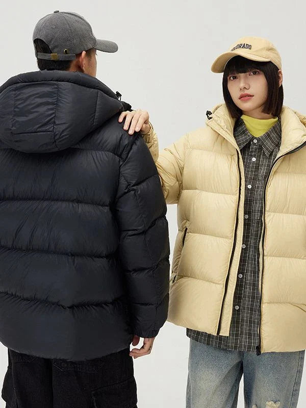 A stylish and warm down jacket with a hooded design, perfect for winter weather.