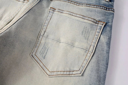 Stylish distressed denim jeans with a skinny, knee-exposed silhouette for a contemporary, high-street fashion look