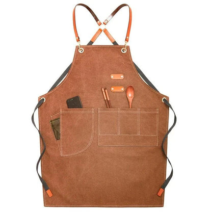Premium canvas barista apron with British-inspired design, perfect for protecting clothing while crafting coffee.