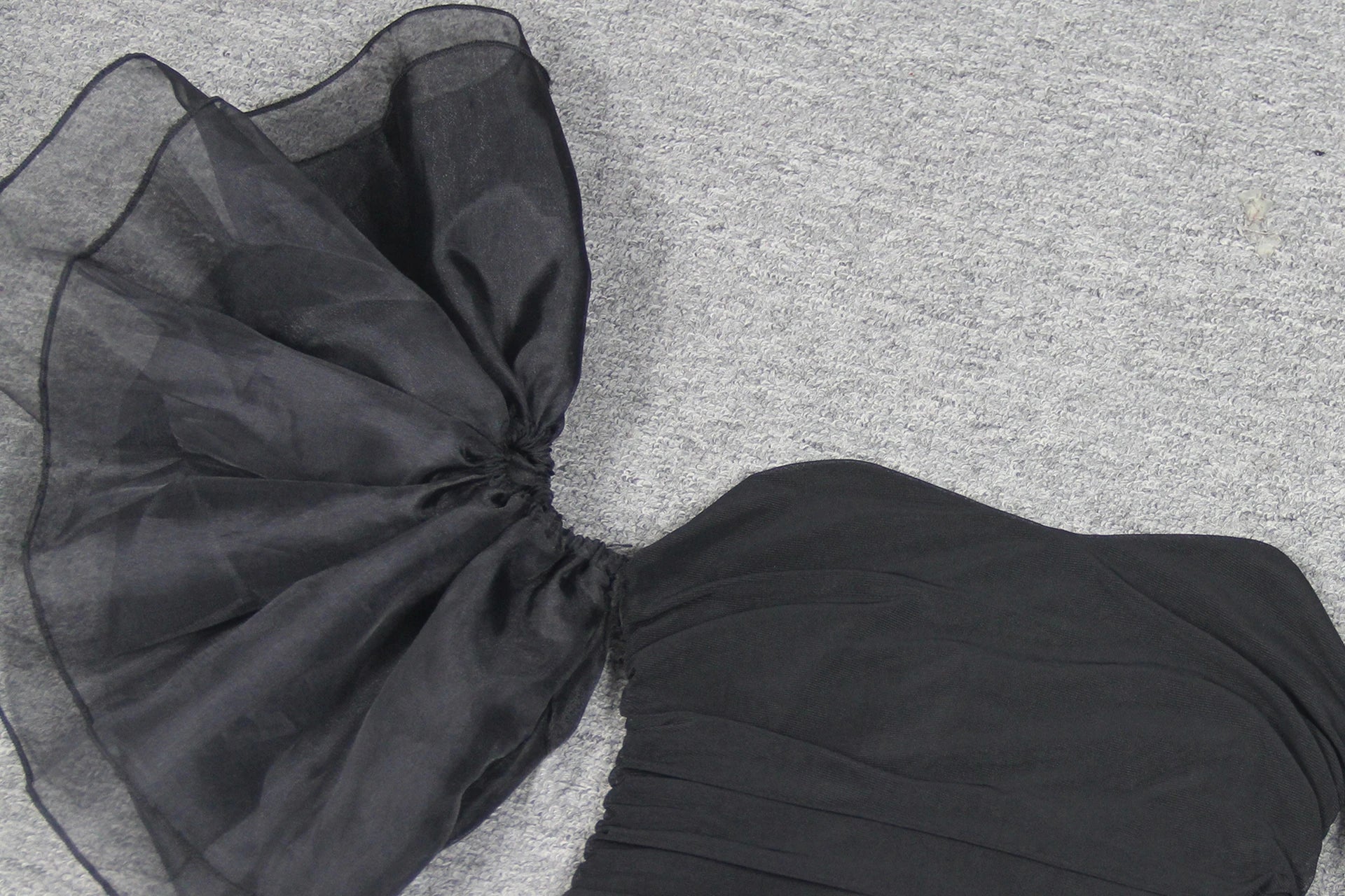 Elegant puff sleeve mesh dress with a flattering short, irregular skirt in white and black colours