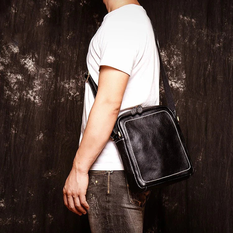 A premium cowhide leather satchel bag with a single shoulder strap, designed for the discerning British gentleman