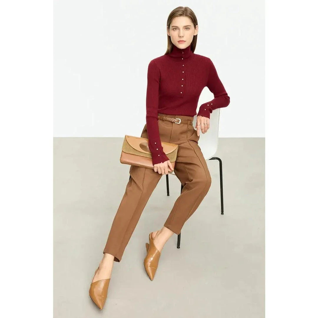 Elegant, slim-fit turtleneck sweater in various colours with chic button detail, perfect for the modern British woman's autumn wardrobe
