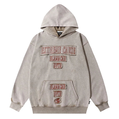 Embroidered cotton hoodie with a letter patch design, available in brown, grey, and black colours and sizes S to XL
