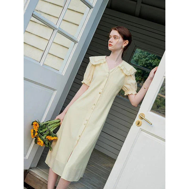 Elegant Navy Sailor Collar Dress with Signature Fungus-Edged Sleeves, a knee-length dress with a unique collar and delicate sleeve details