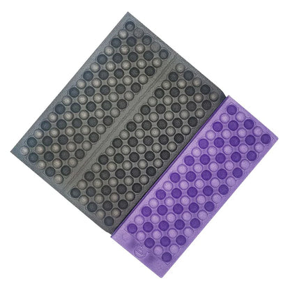Foldable, waterproof camping mat made of high-quality XPE foam with honeycomb protrusions for added comfort and support