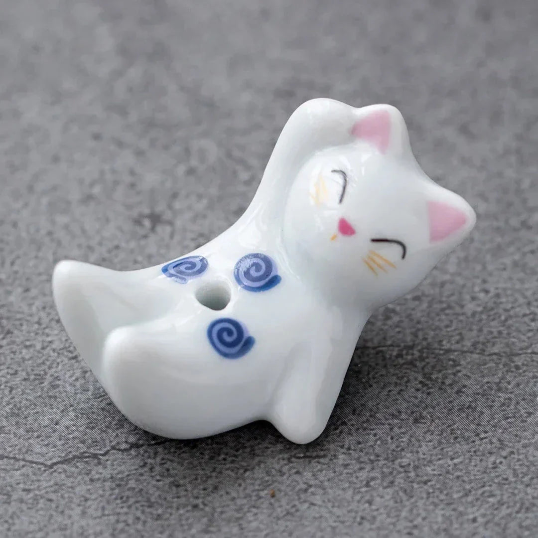 Charming Japanese-style ceramic incense holder with a playful rabbit and kitten design, perfect for creating a relaxing atmosphere in any room.