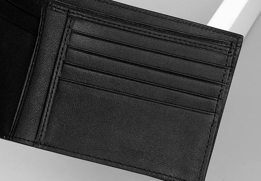 Sophisticated men's leather wallet in black, made from premium crocodile skin for a refined and durable everyday accessory
