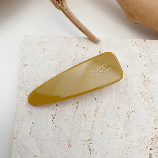Two marble-patterned hair clips in a contemporary geometric design, made from high-quality acetate and acrylic materials.