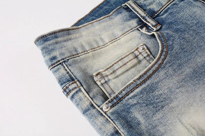 Stylish distressed denim jeans with a skinny, knee-exposed silhouette for a contemporary, high-street fashion look