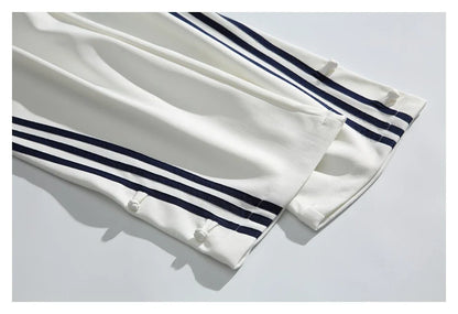 Stylish striped sports trousers in a relaxed, mid-waist design for versatile leisure and athletic wear
