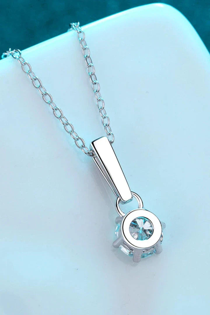 Elegant 1 carat moissanite and sterling silver necklace with a polished, modern design