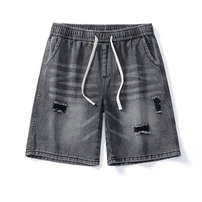 Premium British-crafted vintage-inspired ripped denim shorts for men with a straight-leg silhouette and authentic distressed details