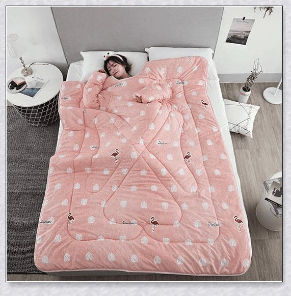 A cosy, wearable quilt with sleeves in a variety of colourful designs, perfect for staying warm and comfortable during the winter months.