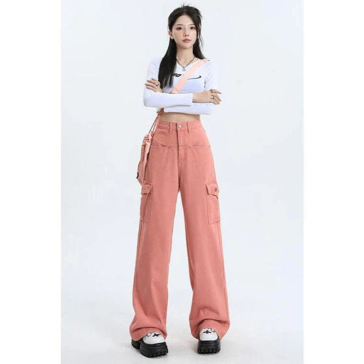 A pair of pink high-waist baggy jeans with a straight-leg design, featuring vintage-inspired details like buttons and faux zippers.