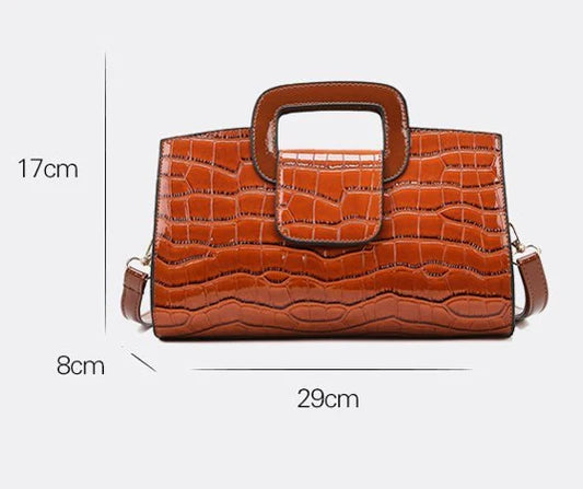 A stylish and versatile retro-patterned handbag with a sturdy canvas construction and organised interior, perfect for everyday use in the UK.