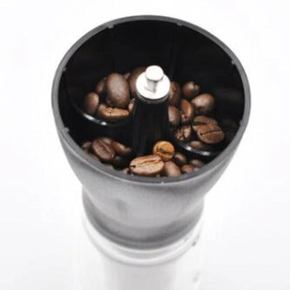 Stylish powder coffee grinder in black and red, with a manual grinding mechanism for consistent and freshly ground coffee.