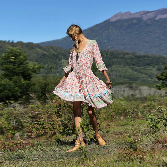 Elegant Bohemian-inspired pleated print dress in a vibrant pink colour, perfect for a day at the British seaside resort.