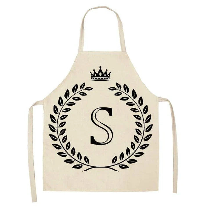 A high-quality kitchen apron featuring a charming crown and letter print design in a premium cotton and linen blend fabric.