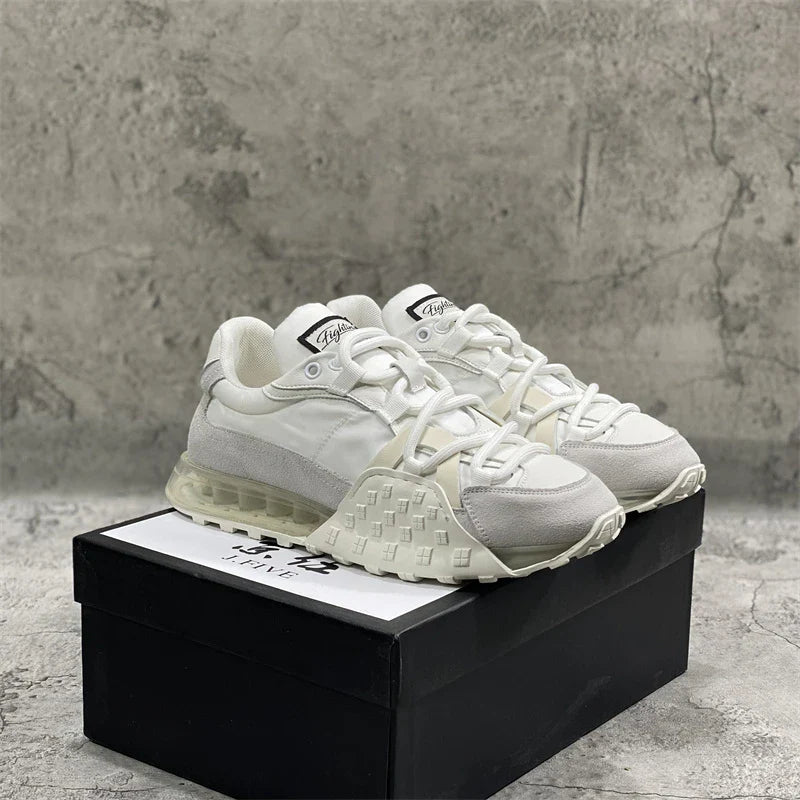 Premium leather lace-up trainers in white with breathable inner lining and slip-resistant rubber sole