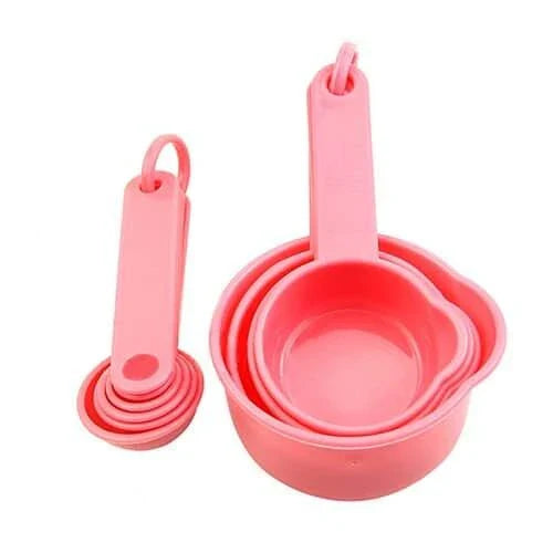 A set of 10 pink baking measurement cups and spoons made from food-grade plastic for precise ingredient measurements