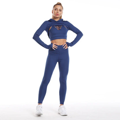 A 3-piece sports set including a hooded top, sports bra, and high-waisted leggings in a black colour scheme.