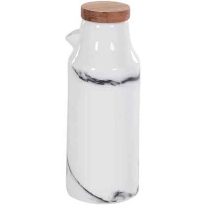 Ceramic salt and pepper shaker set with oil bottle in light grey porcelain finish, featuring minimalist design and easy-grip handles