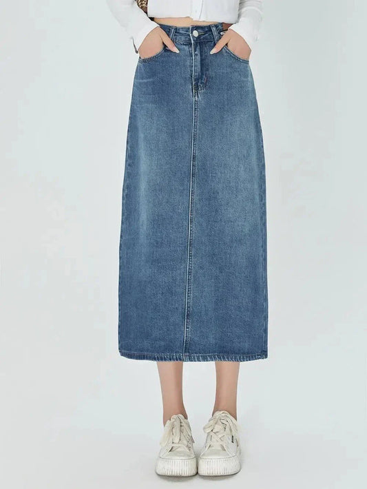Classic blue A-line midi denim skirt with flattering empire waistline and flowy silhouette