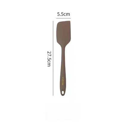 A set of two high-quality silicone spatulas in brown and yellow colours, designed for versatile cooking and baking tasks.