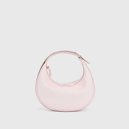 Stylish crescent-shaped leather crossbody bag with soft, supple texture for everyday elegance