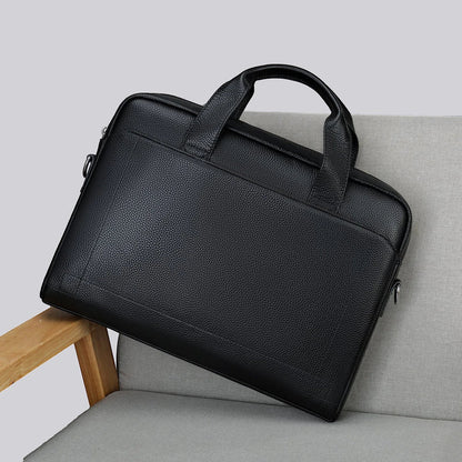 Men's genuine leather briefcase in dark coffee colour, featuring a spacious interior and adjustable shoulder strap for versatile carrying
