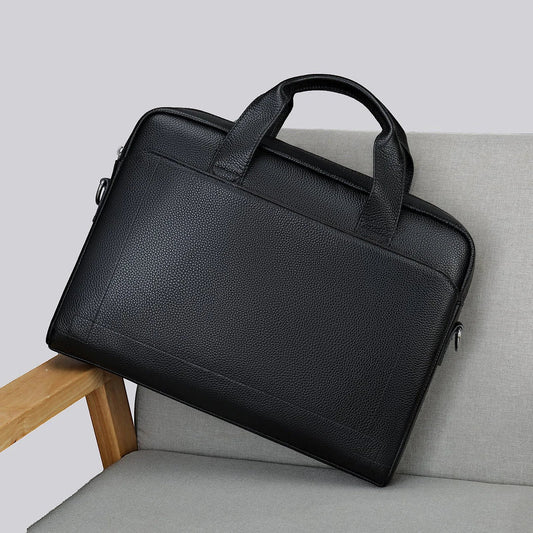 Men's genuine leather briefcase in dark coffee colour, featuring a spacious interior and adjustable shoulder strap for versatile carrying