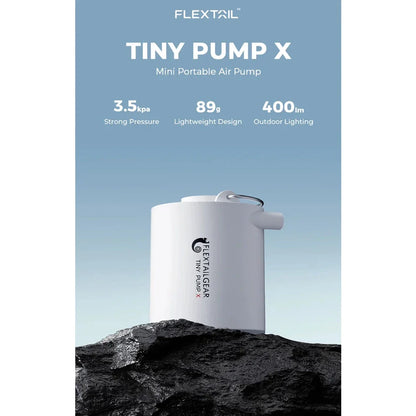 Compact portable electric air pump with built-in LED light for outdoor adventures and storage solutions